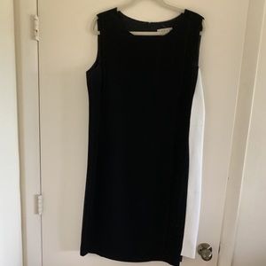 Sophisticated black dress with white faux leather insert